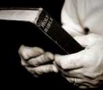 Man_holding_bible-63271